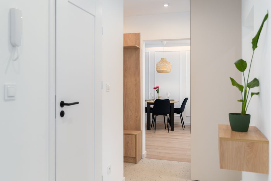 Bright and airy modern apartment interior with minimalist design elements and natural light.